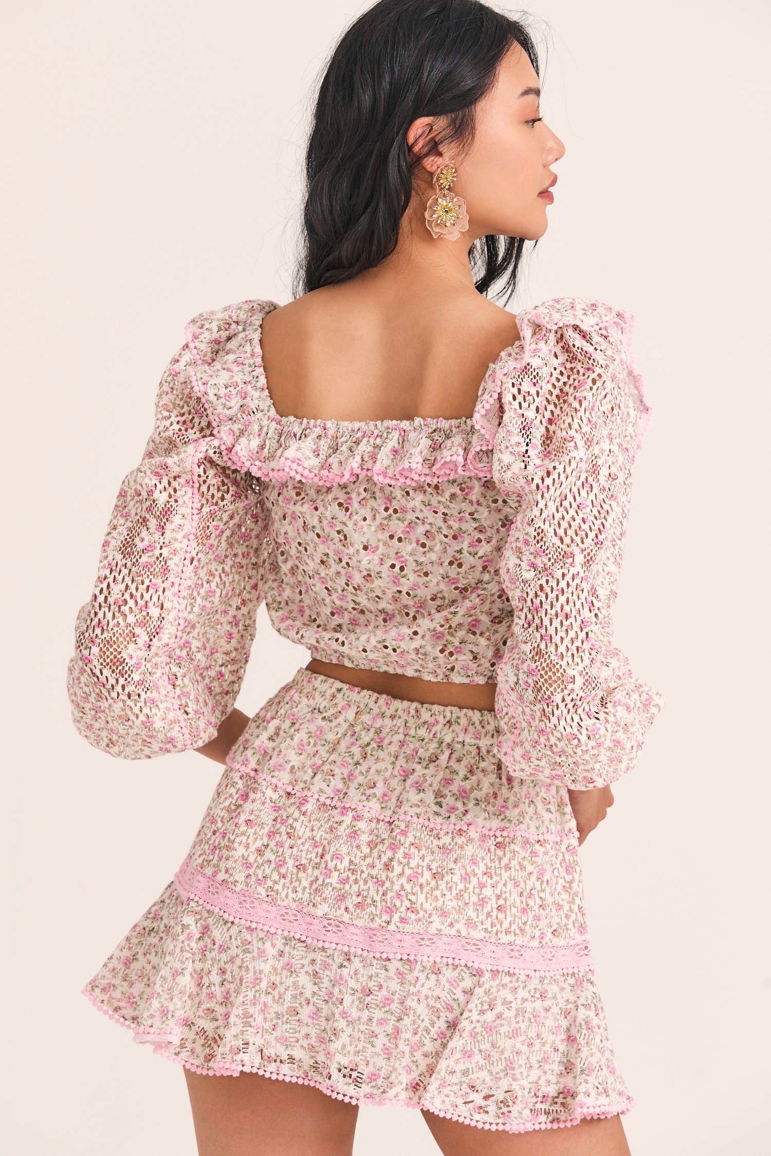 Women's three quarter sleeve cropped top with custom lace and eyelet fabrication, in a mixed micro floral print. 