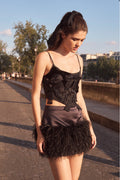 Black bow bustier top with ruffled layered appliques and thin spaghetti straps