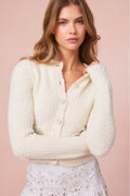 Cream wool-blend cardigan with scalloped neckline, button front, heart sequin pockets