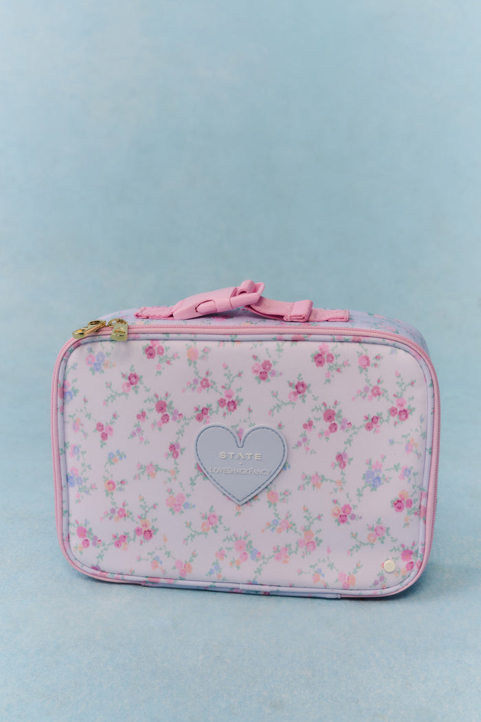 Floral-patterned pouch with a heart design on a light blue background