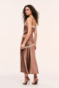Mocha satin slip skirt with cream lace trim around the hips and vertical trim on edge of the front slit, back view