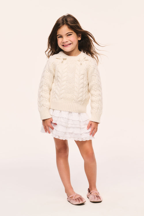 Girls' Mavita mini pullover sweater in cream, cable knit, long sleeves, crew neck and bow details at the neck