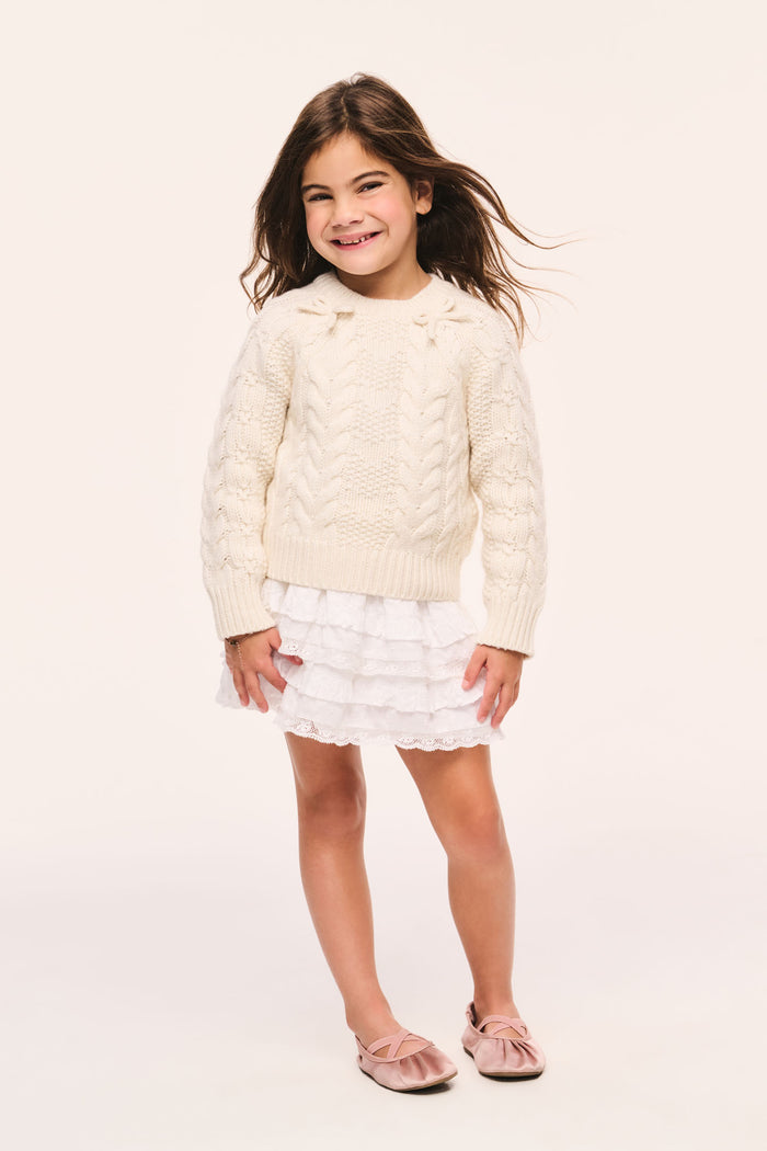 Girls' Mavita mini pullover sweater in cream, cable knit, long sleeves, crew neck and bow details at the neck