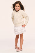 Girls' cream cable-knit pullover with crew neck and long sleeves, ribbed cuffs and bow details at the neck
