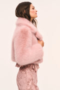 Cropped faux fur jacket in light mauve, side view with plush collar and full sleeves