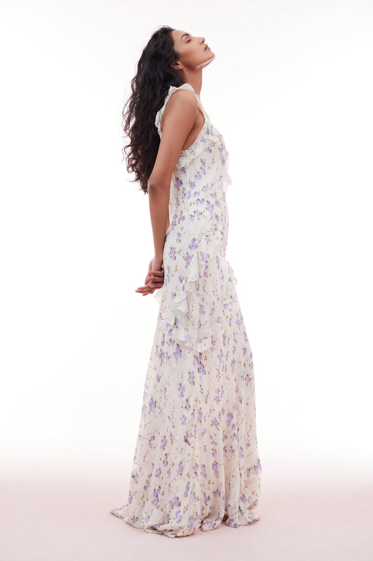 Floral printed maxi dress with lace straps, flutter sleeves, and ruffle details all over.