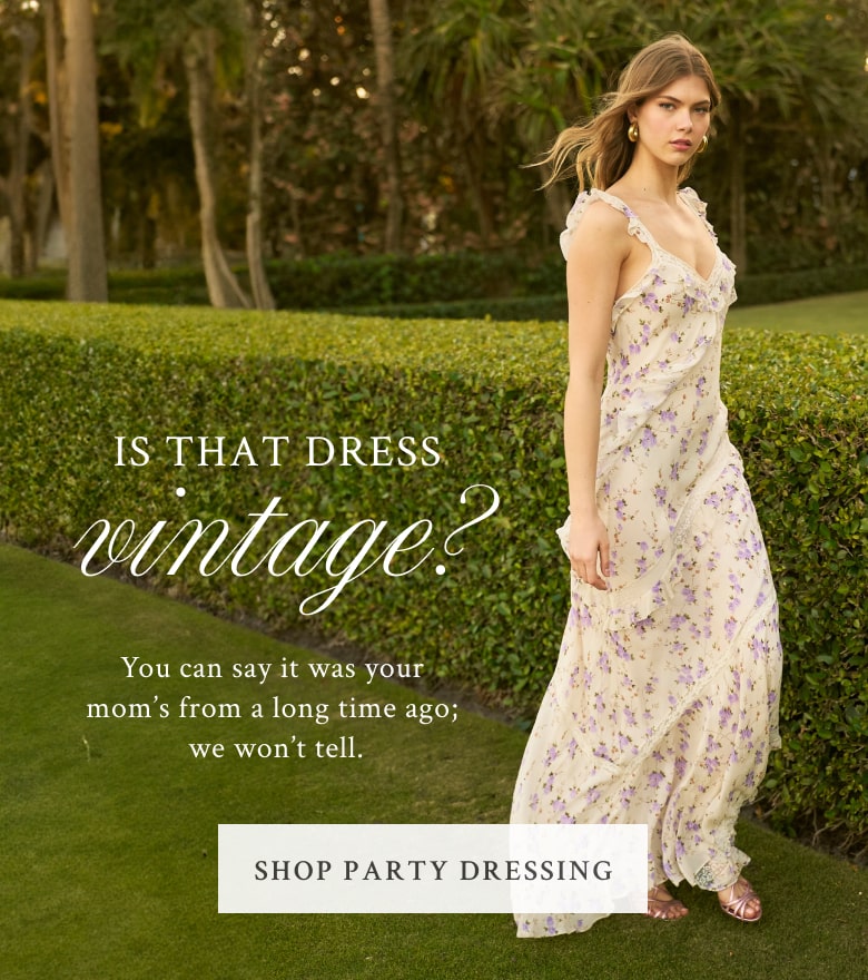 Model wearing a sleeveless maxi floral dress. Shop the Party Dressing collection.