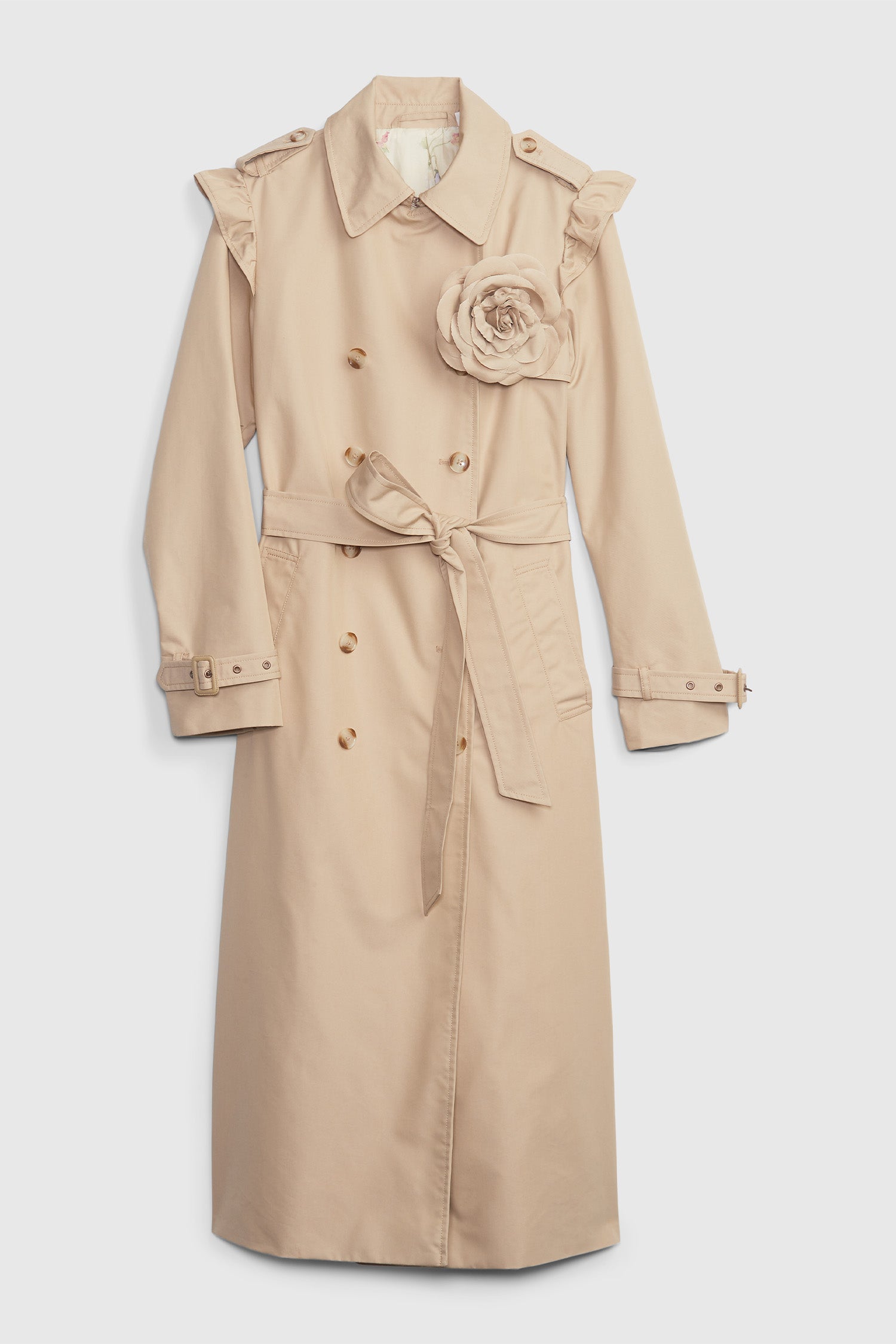 Khaki trench coat with rosette detail on chest, ruffle shoulders, and waist tie