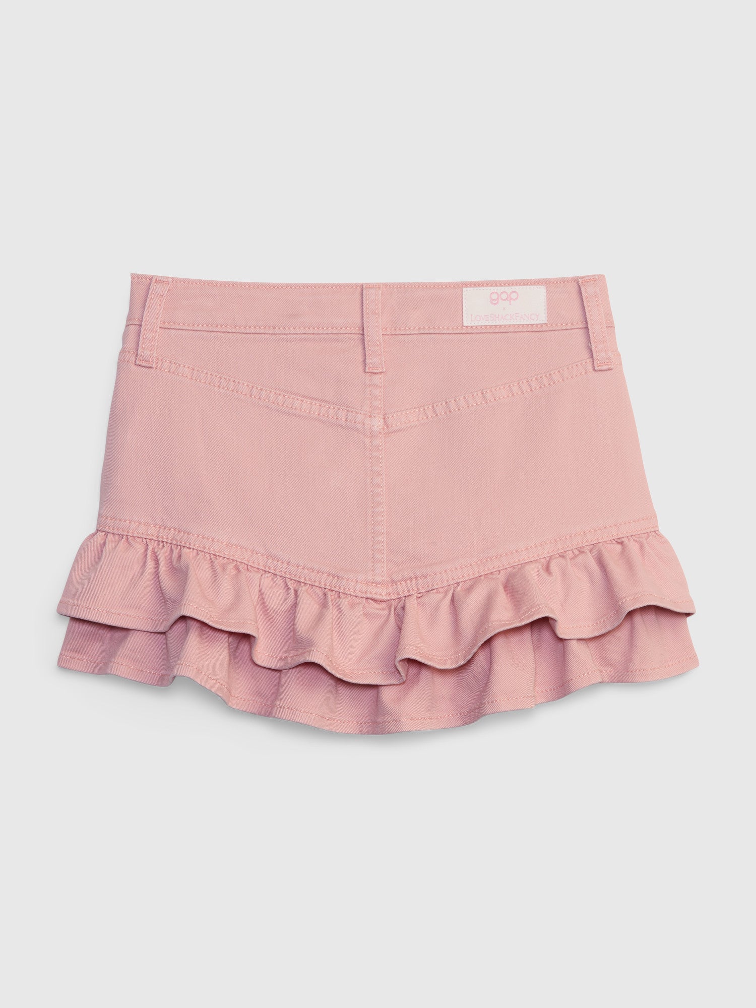 Back image of kids pink denim mini skirt with ruffle hem