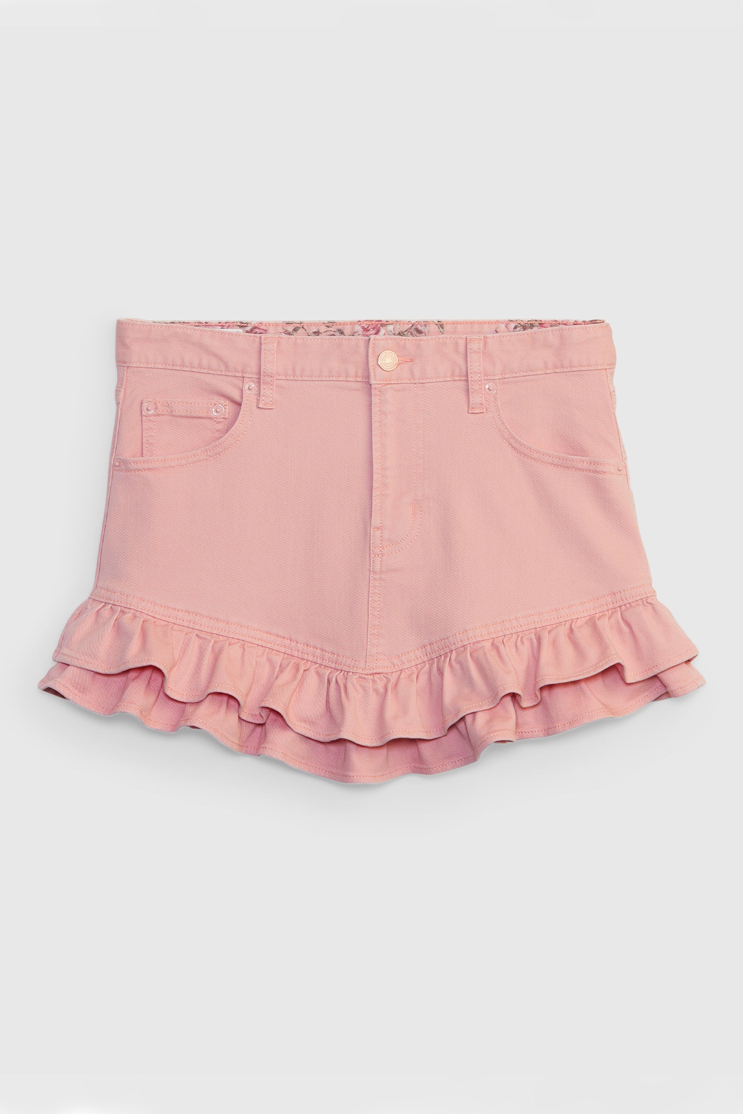 Pink denim mini skirt with ruffle detail at hem