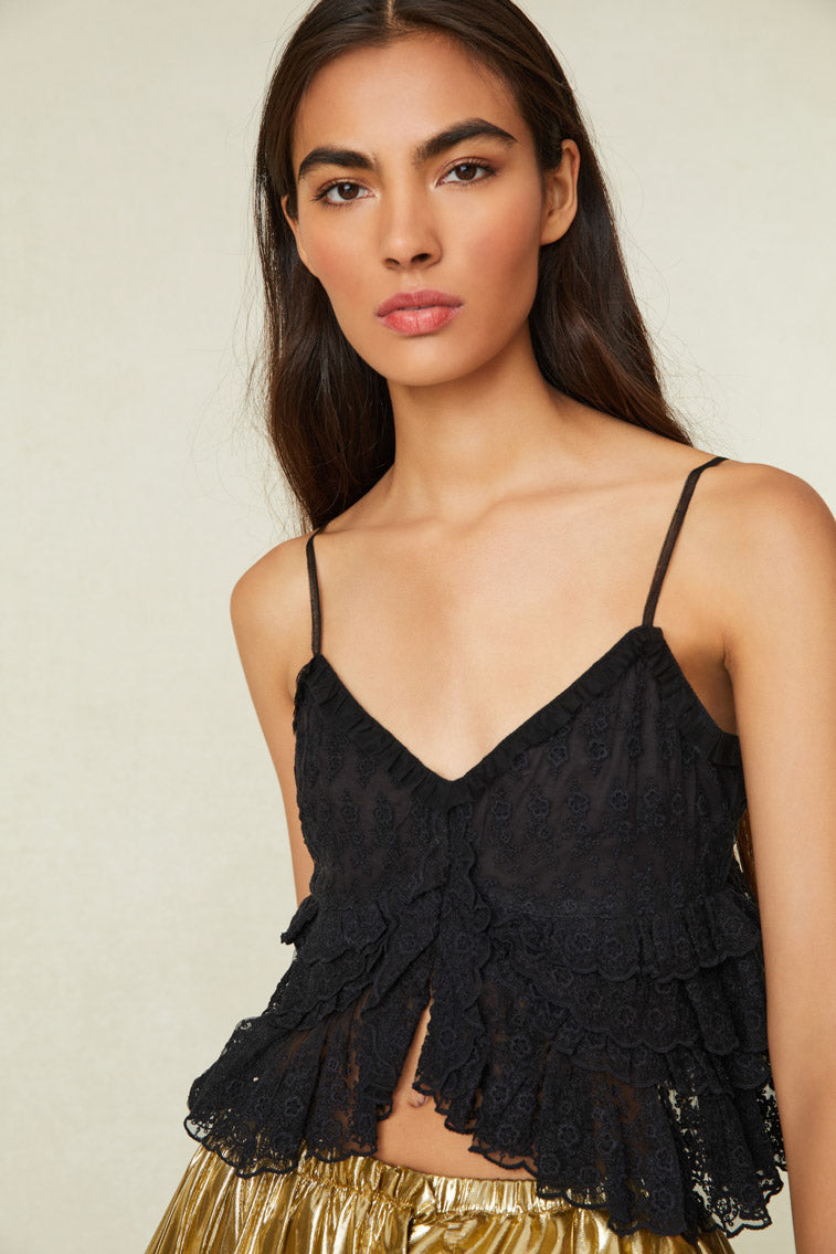Black Tank Top with High to Low Feature at bottom hem- Material is embroidered mesh with scalloped edges and ruffle detailing all over and a fully lined bust. 