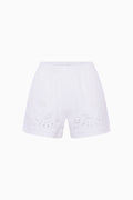 White eyelet shorts on white background
