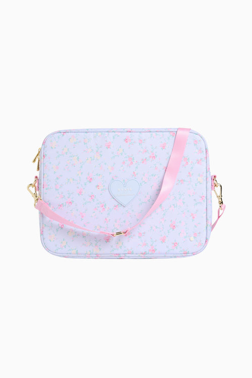 Transparent pouch with pink heart design and pink strap on a white background