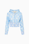 Light blue hoodie with bow pattern on a white background