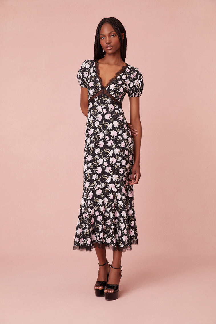 dress is designed from a drapey, soft crepe fabric featuring a sweet tossed floral print all over.