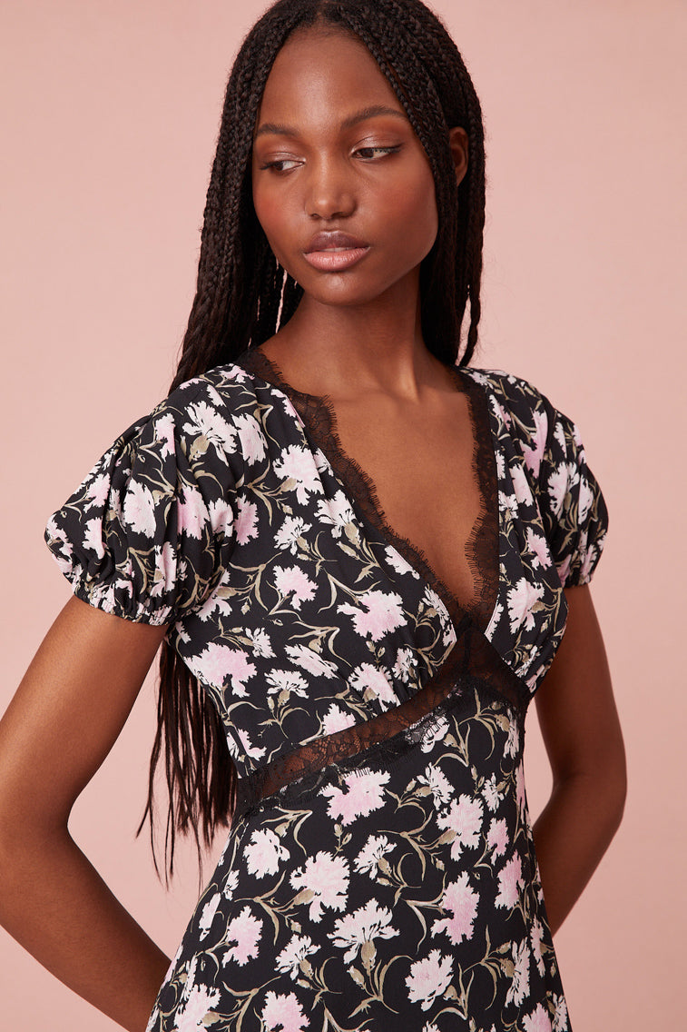dress is designed from a drapey, soft crepe fabric featuring a sweet tossed floral print all over.