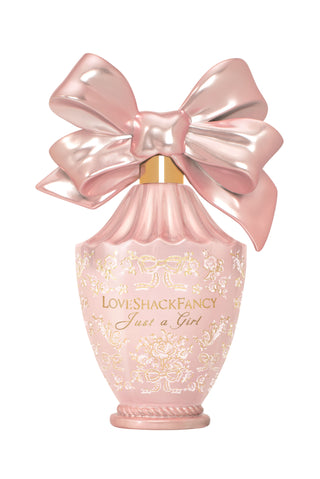 Pink eau de parfum bottle with large satin bow and decorative embossed label
