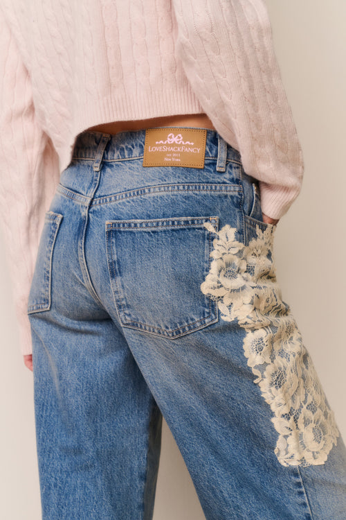 Pink sweater and Blue jeans with floral lace appliqué