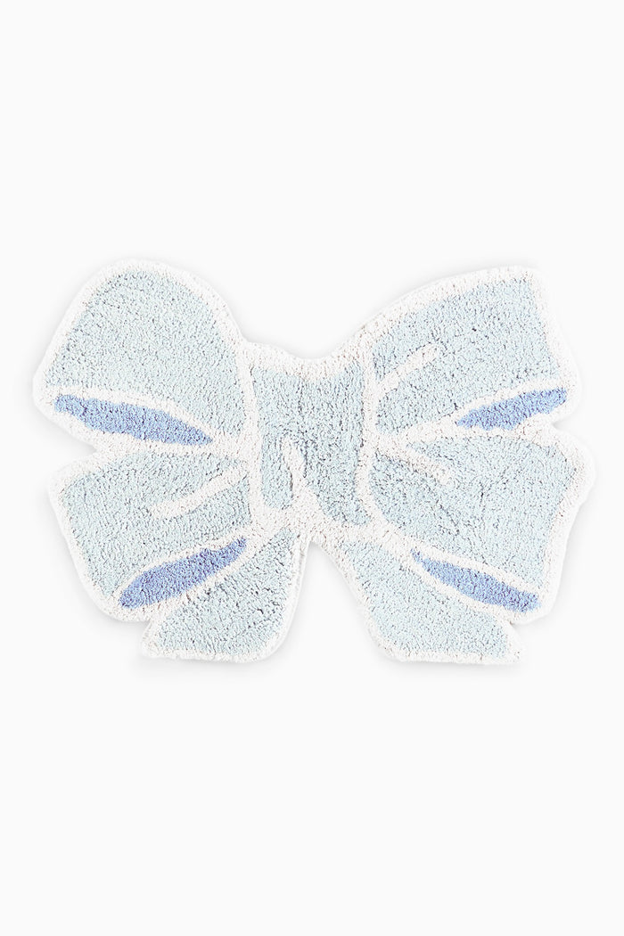 Light blue textured bow rug on a white background