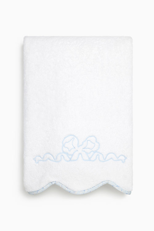 White towel with blue embroidery on a white background