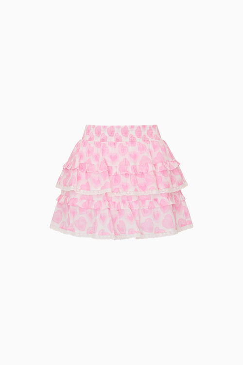 Pink tiered skirt with pink heart pattern on a white background