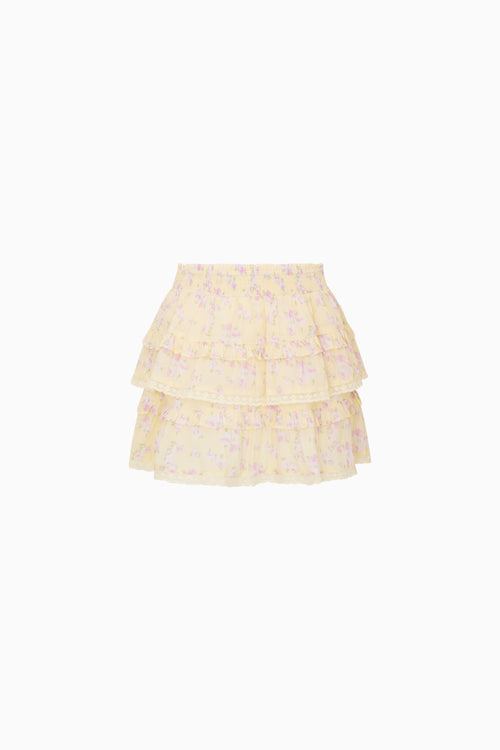 Yellow tiered skirt with floral pattern on a white background