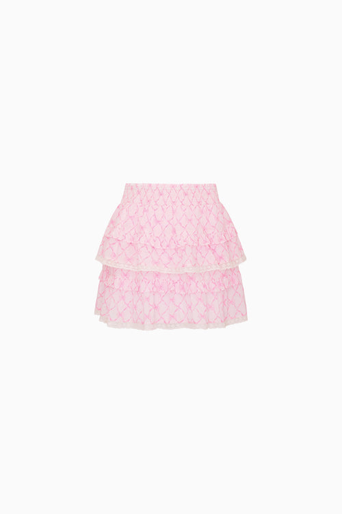 Pink layered skirt with bow pattern on a white background