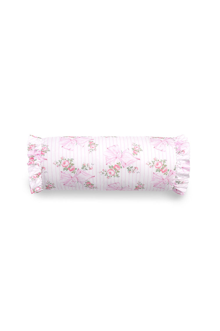 Bolster pillow with ruffle details and a floral bow print.