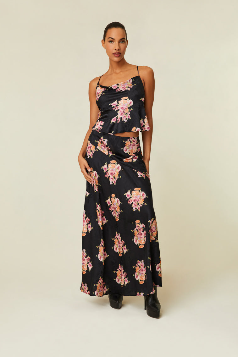 Maxi skirt features a dreamy peony jacquard print on a rayon silk blended fabric. 