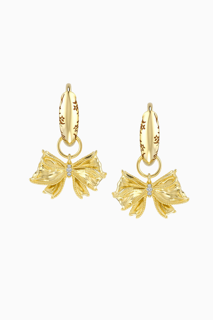 Gold bow-shaped earrings on a white background