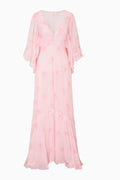 Maxi longsleeve pink dress with floral pattern on a white background