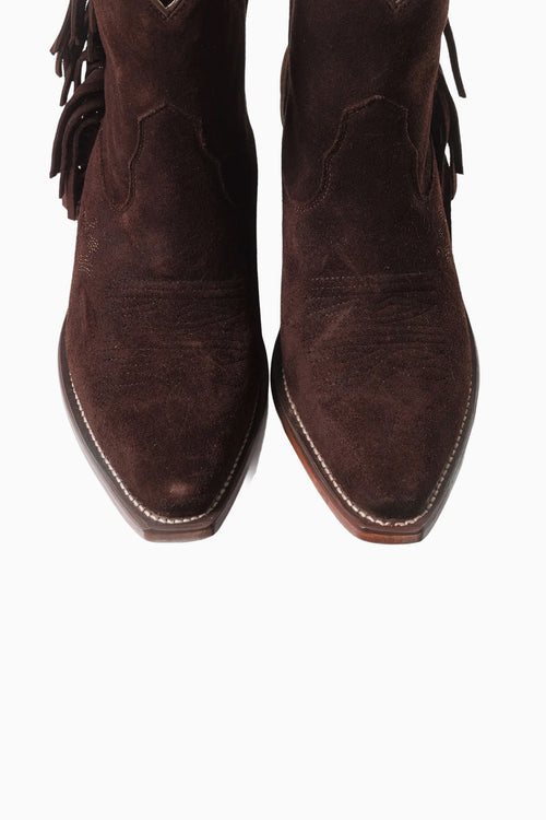 Pair of brown suede boots with fringes on a white background