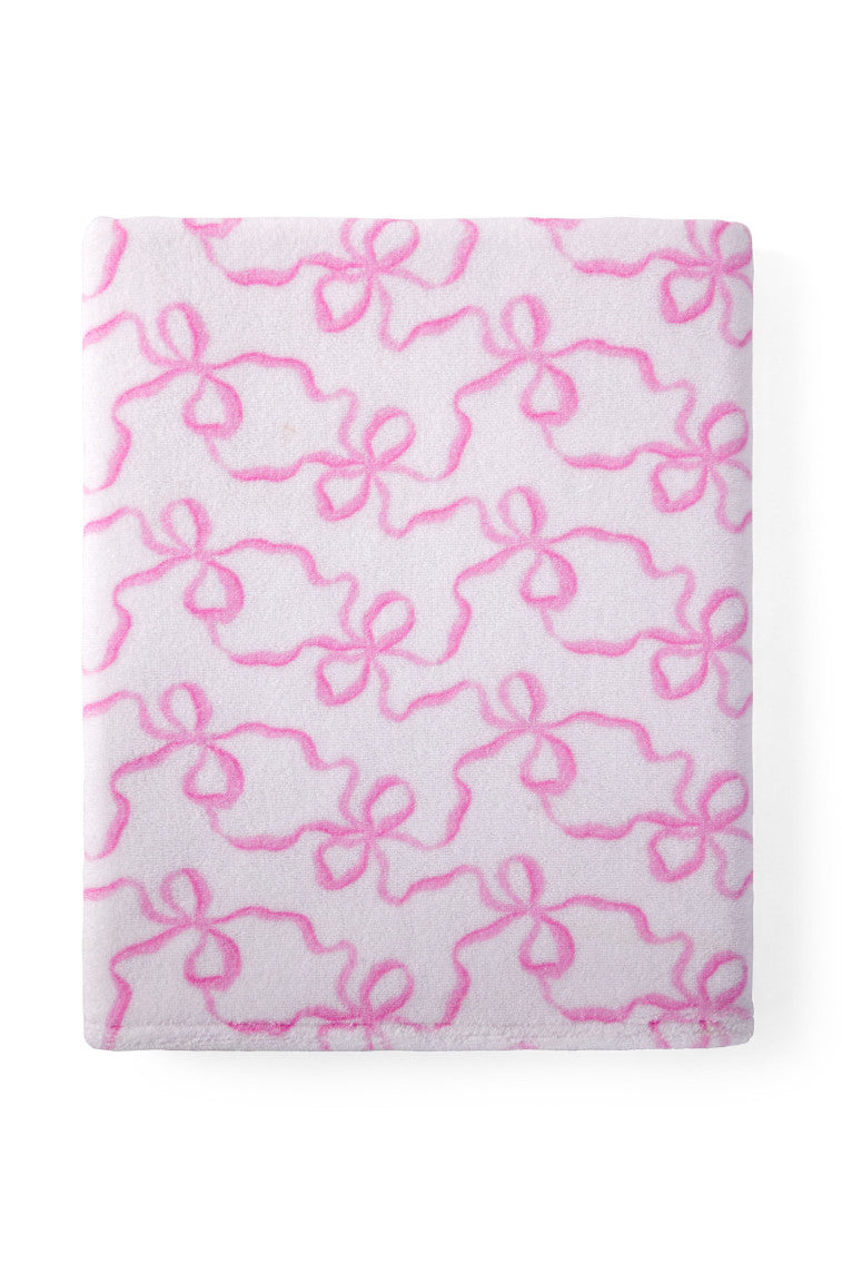 Woven towel with a bow print.