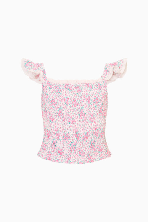 Floral-patterned top with ruffled shoulders on a white background