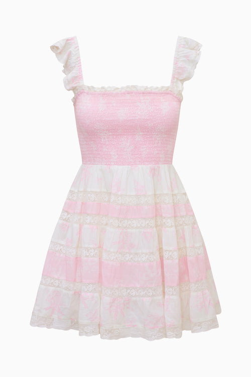 Pink and white dress with ruffled sleeves on a white background