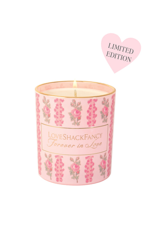 Pink floral candle with 'LoveShackFancy' branding on a white background