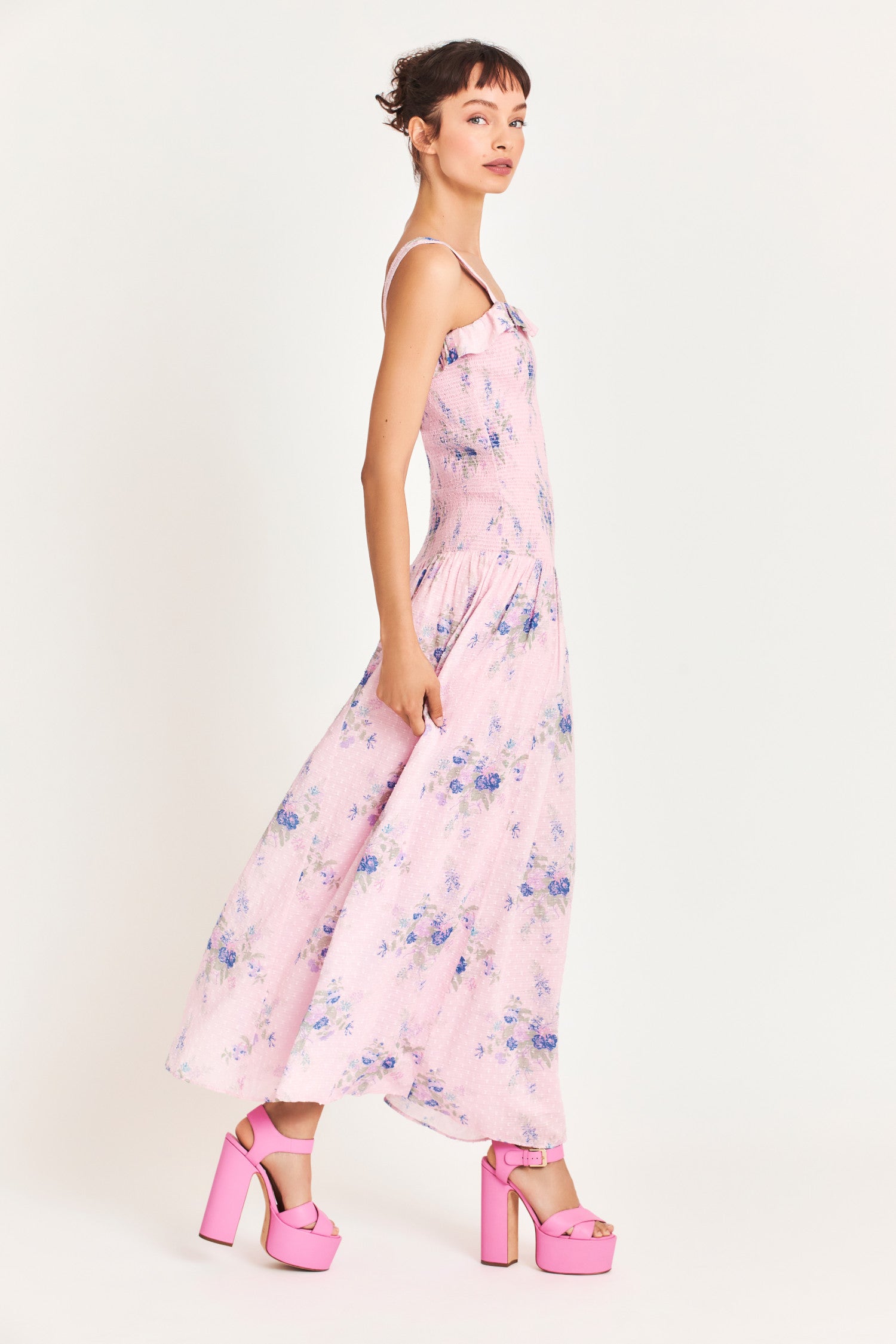  Pink Maxi dress with a blue heirloom bouquet print on a soft textured dot cotton fabric and a smocked bodice that releases into a sweeping A-line skirt. 