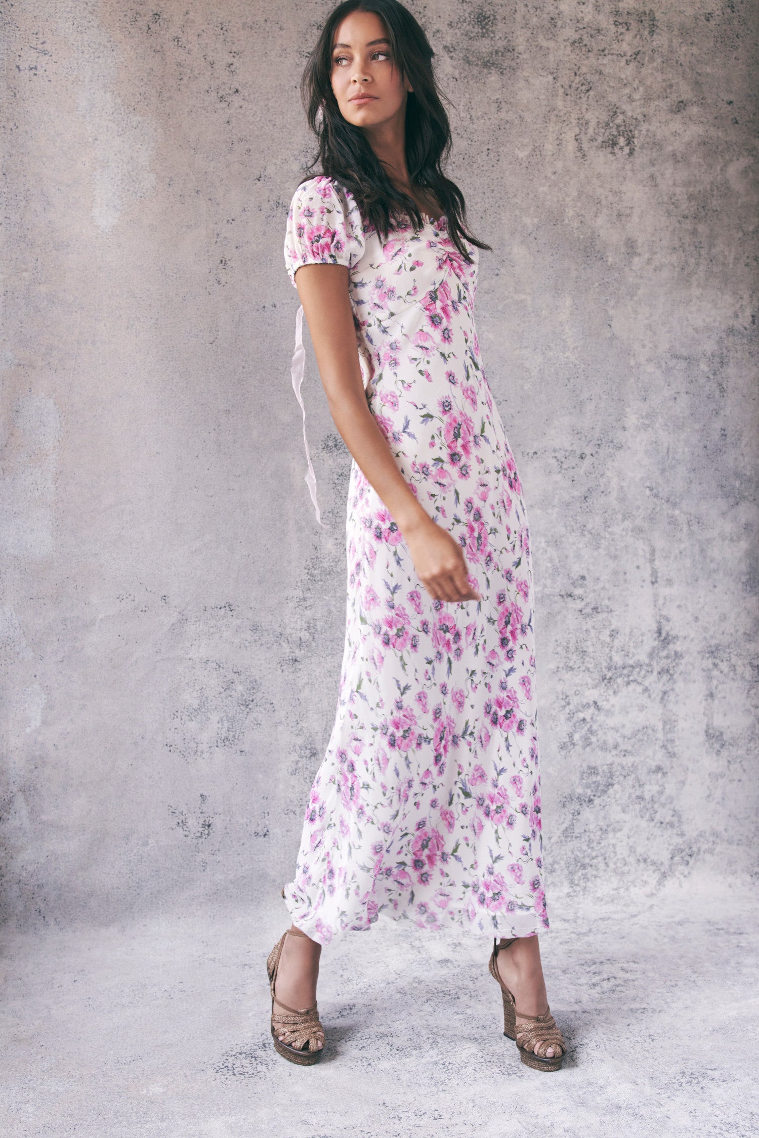 Model wearing pink and white floral short sleeve maxi dress