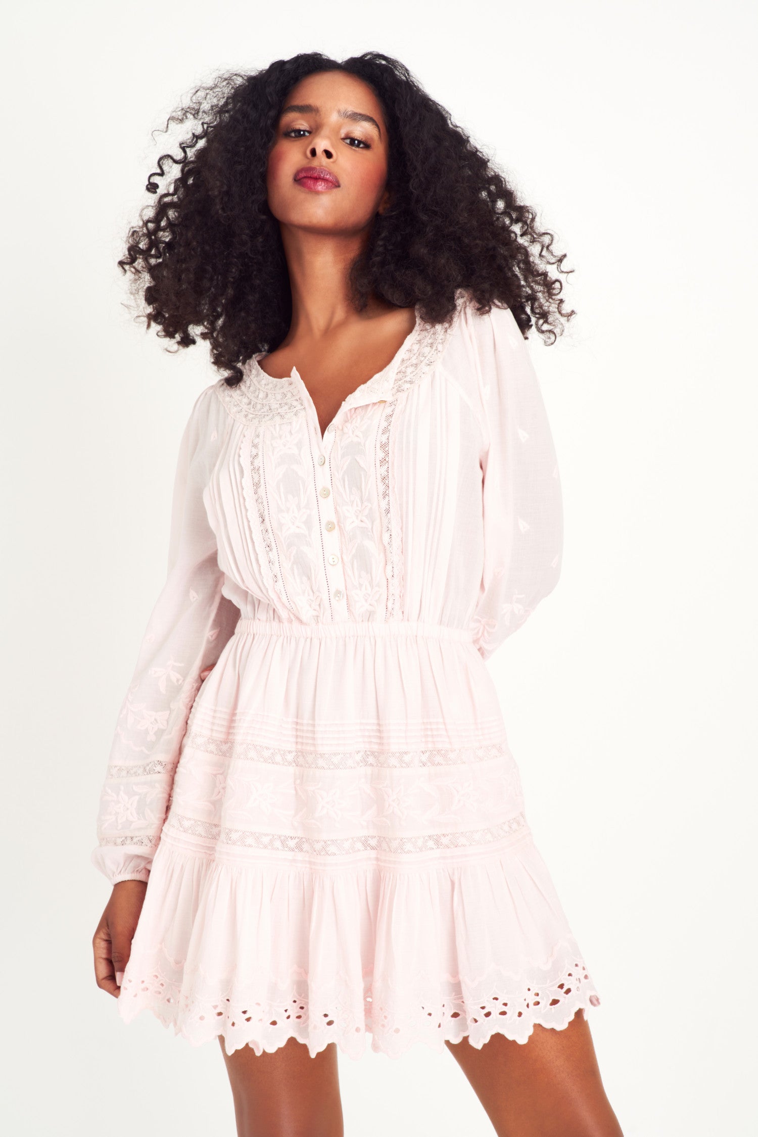 Model wearing pink long sleeve mini dress