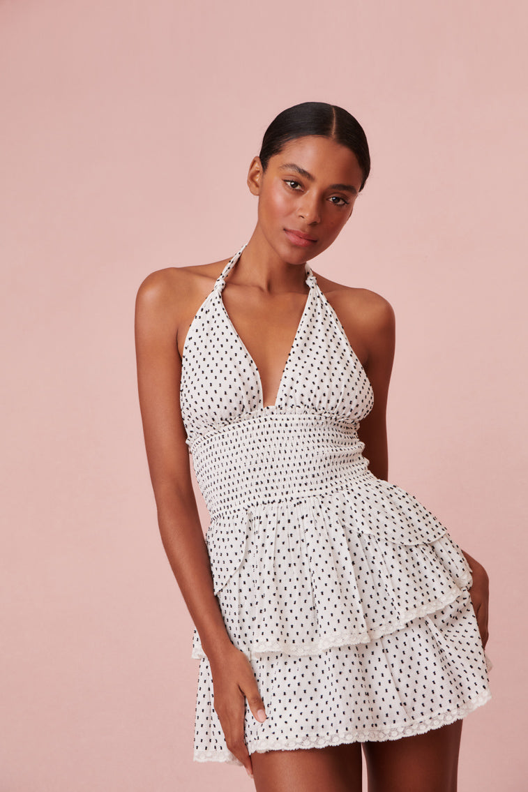 Dotted halter dress with two tiered ruffled skirt.