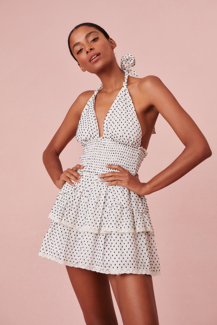 Dotted halter dress with two tiered ruffled skirt.