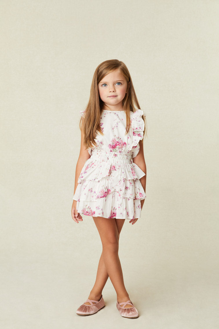 Girls white and pink Floral Dress with a ruffle-trimmed collar, buttons down center front, flutter sleeves, an elastic waist and overlapping asymmetrical ruffles at the skirt.