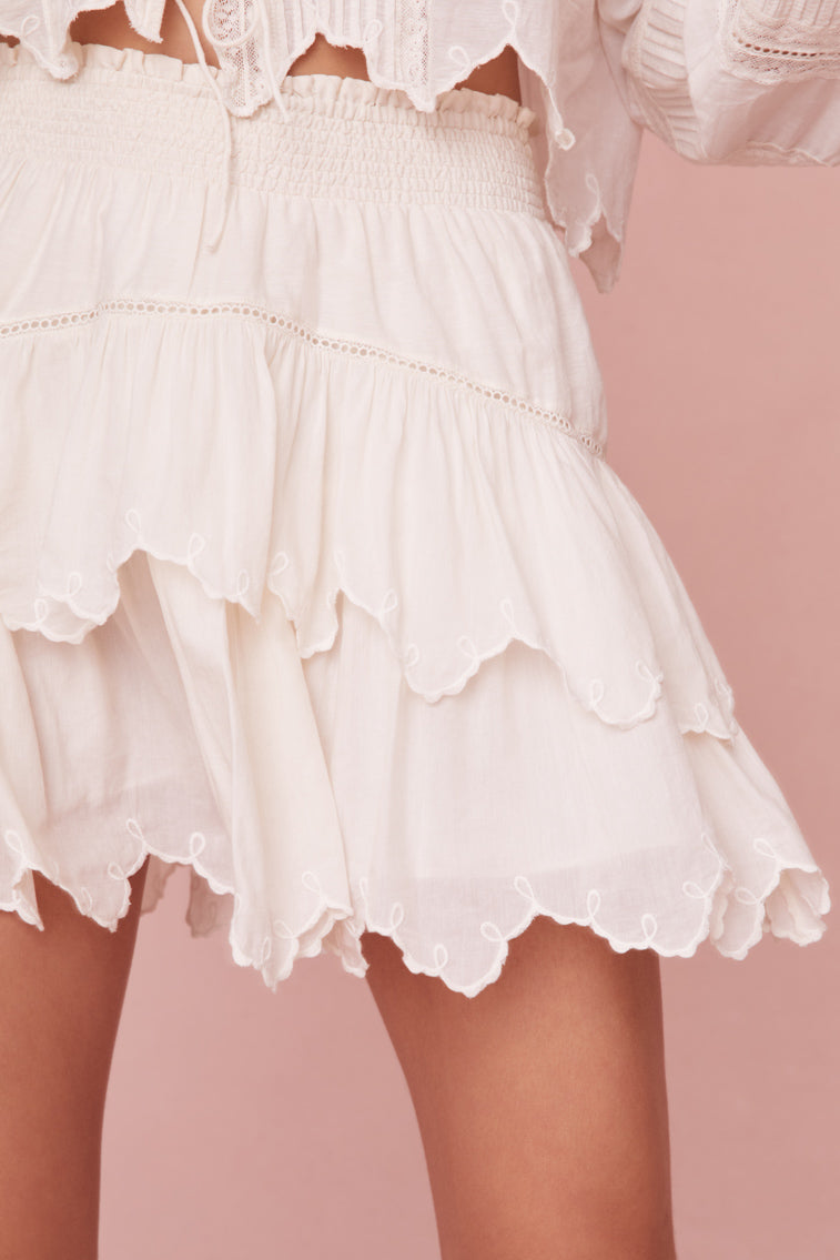 Mini skirt with embroidered tiers. 