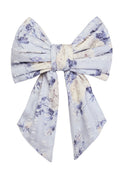Bow-shaped barette in blue floral print.