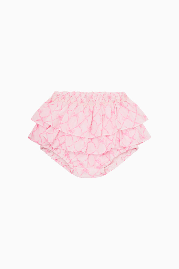 Pink ruffled baby bloomers on a white background