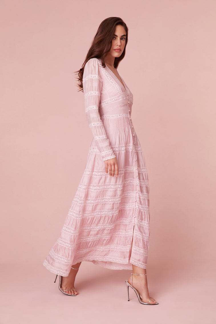 Button-through maxi dress featuring a modest V-neck, a versatile button closure, a fixed waist for definition, and long sleeves