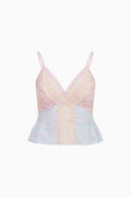 Pastel-colored lace sleeveles top on a white background