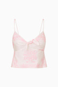 Pink patterened camisole on a white background