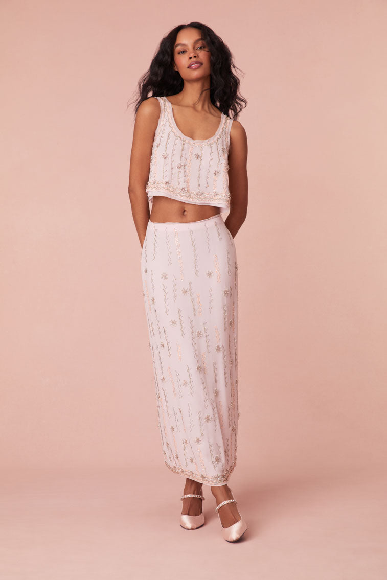 Long skirt with embroidery and beading all over in the form of a zig zag pattern with stars, finished with a fixed waistband.