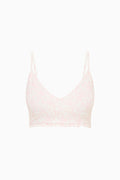 Light pink bralette on a white background